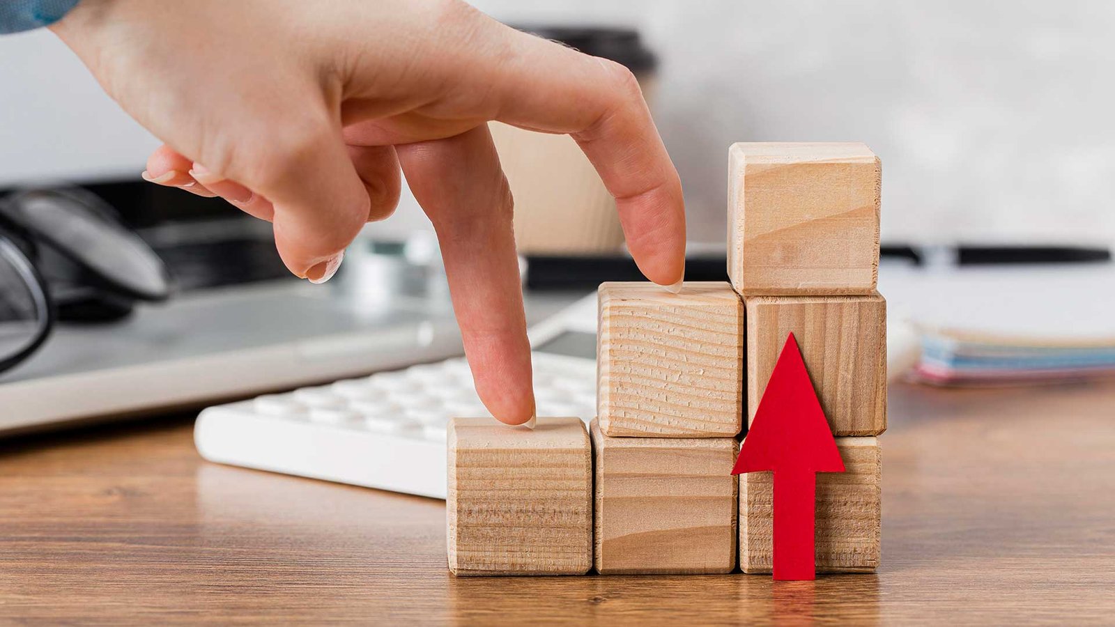 hand-climbing-wooden-blocks-represent-growth